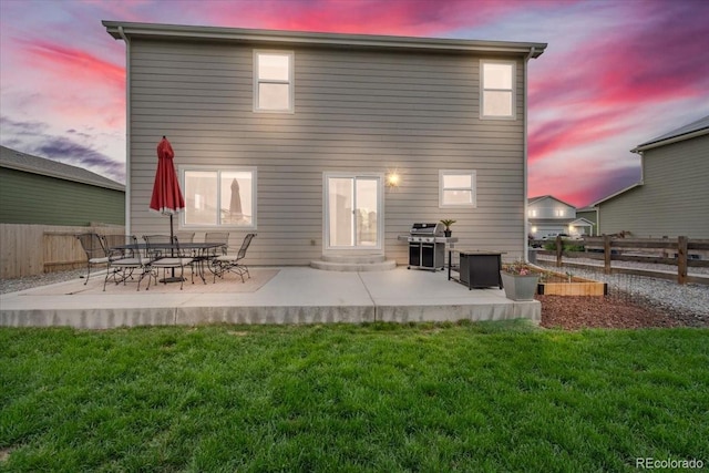 7218 Animas Ave, Frederick, CO 80530 - back of property at dusk with a patio