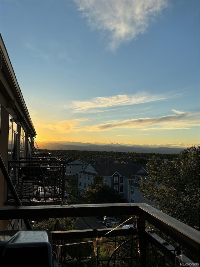 view of balcony at dusk