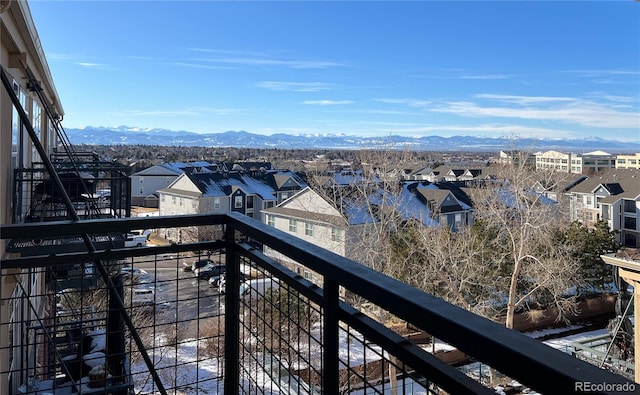 balcony featuring a residential view and a mountain view