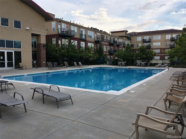 community pool with a patio area