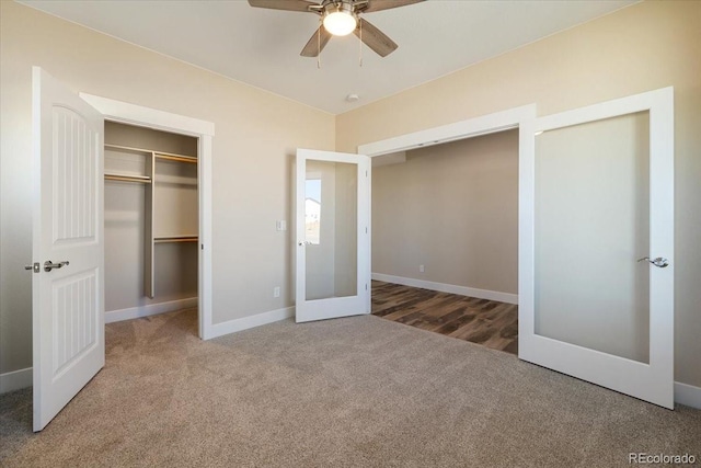 unfurnished bedroom with french doors, ceiling fan, and carpet