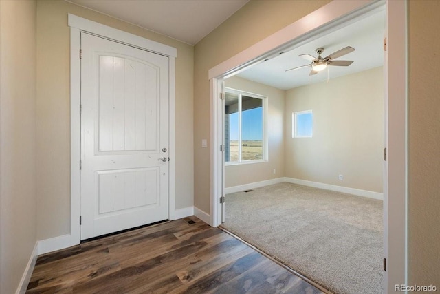 entryway with dark wood-type flooring and ceiling fan