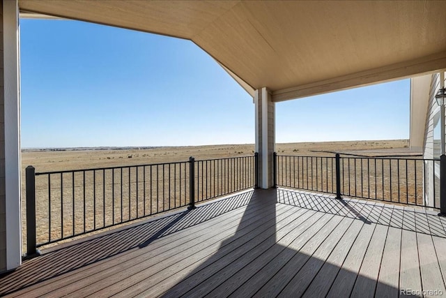 wooden terrace with a rural view