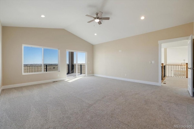 unfurnished living room featuring ceiling fan, vaulted ceiling, and light carpet