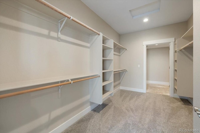 spacious closet with light colored carpet