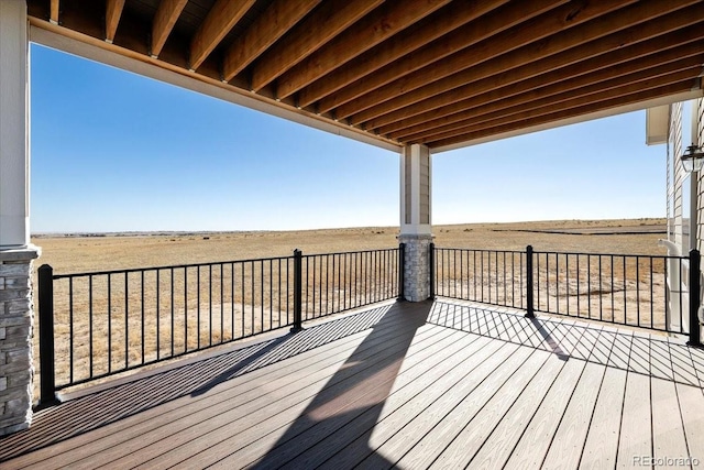 wooden terrace with a rural view