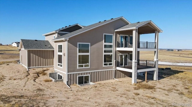 rear view of house featuring a balcony