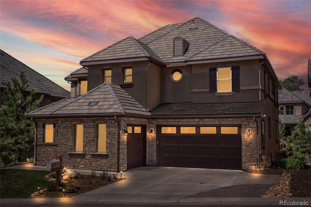 6878 Northstar Ct, Castle Rock, CO 80108 - view of front of property with stucco siding, driveway, stone siding, and a garage