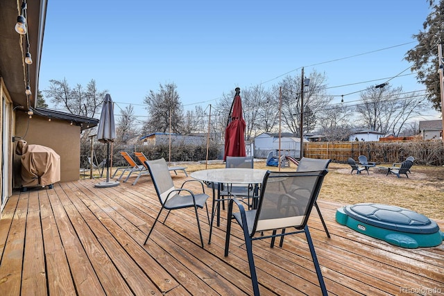 deck featuring an outdoor fire pit