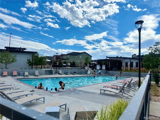 view of swimming pool featuring a patio