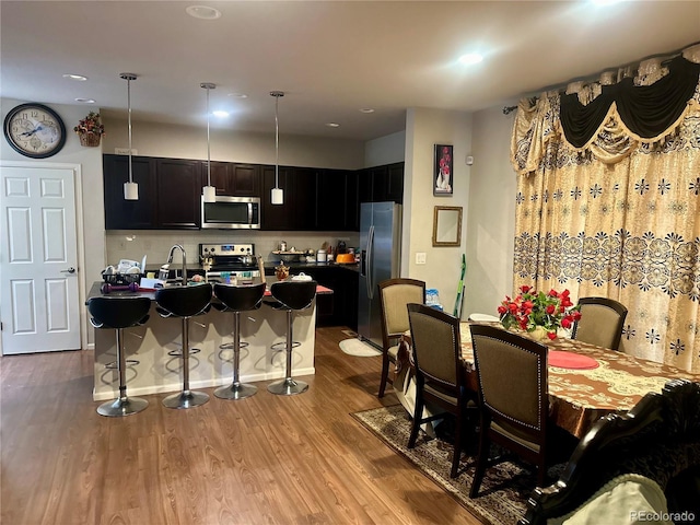 dining room featuring light hardwood / wood-style floors and sink