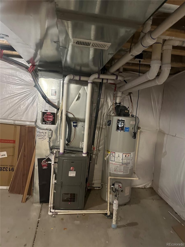 utility room featuring gas water heater