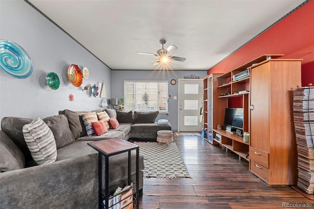 living room with ceiling fan and dark hardwood / wood-style flooring