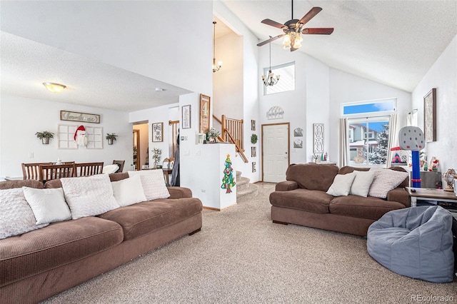 living room with ceiling fan with notable chandelier, high vaulted ceiling, carpet floors, and a textured ceiling