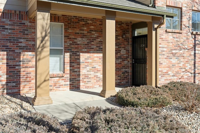 2250 S Vaughn Way Unit 204, Aurora, CO 80014 - doorway to property with brick siding