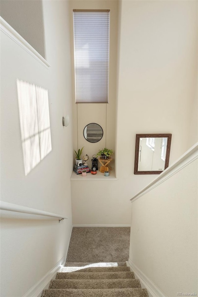 2250 S Vaughn Way Unit 204, Aurora, CO 80014 - staircase featuring carpet floors and baseboards