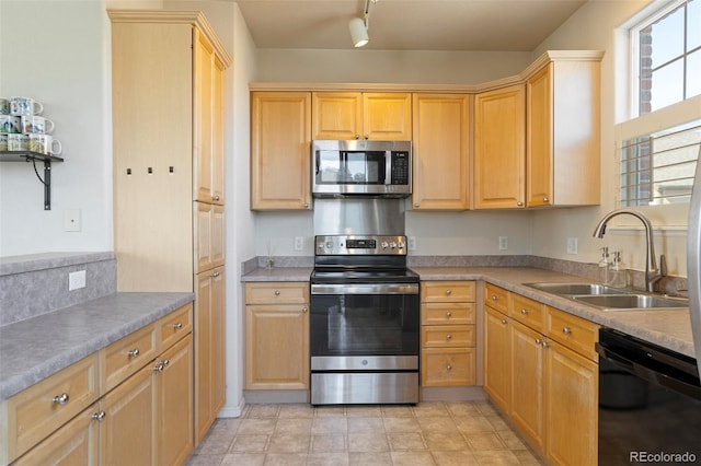2250 S Vaughn Way Unit 204, Aurora, CO 80014 - kitchen with stainless steel appliances and light brown cabinetry
