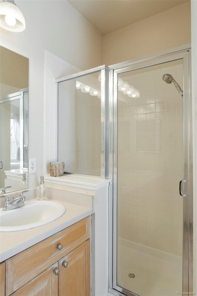 2250 S Vaughn Way Unit 204, Aurora, CO 80014 - bathroom with vanity and a stall shower
