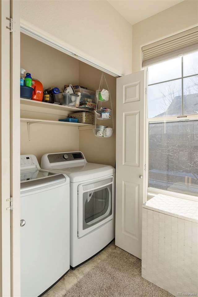 2250 S Vaughn Way Unit 204, Aurora, CO 80014 - laundry room with washing machine and dryer