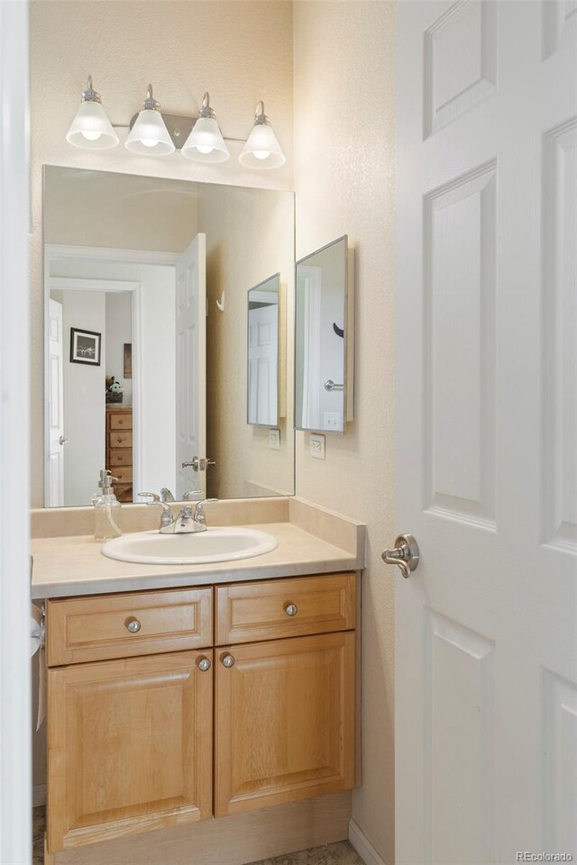 2250 S Vaughn Way Unit 204, Aurora, CO 80014 - bathroom featuring vanity