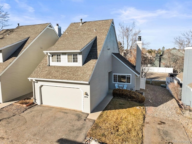 view of side of home featuring a garage