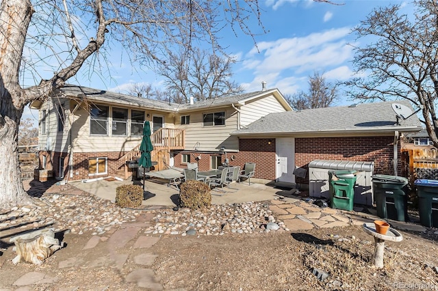 back of property featuring a patio area