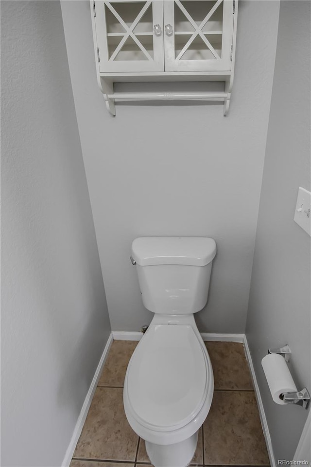 bathroom with tile patterned flooring and toilet