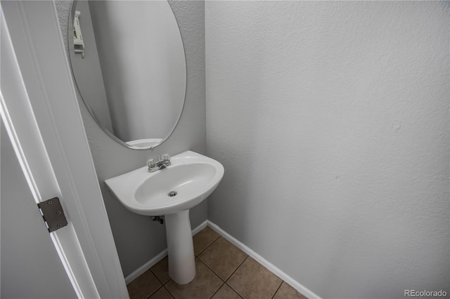 bathroom with tile patterned floors