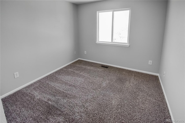 empty room featuring carpet flooring