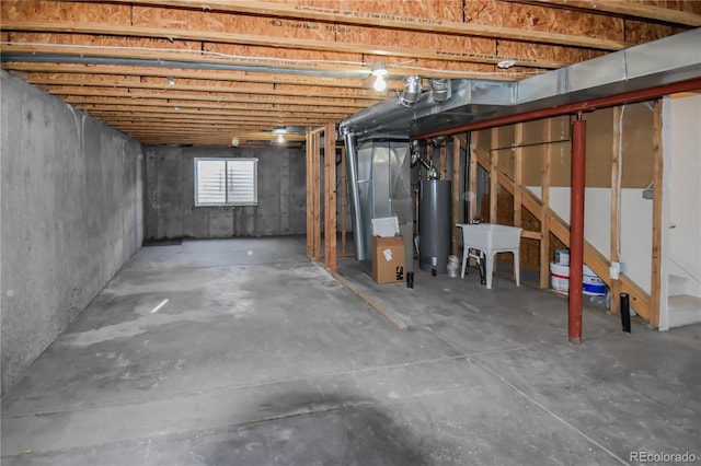 basement featuring heating unit and water heater