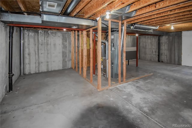 basement featuring heating unit