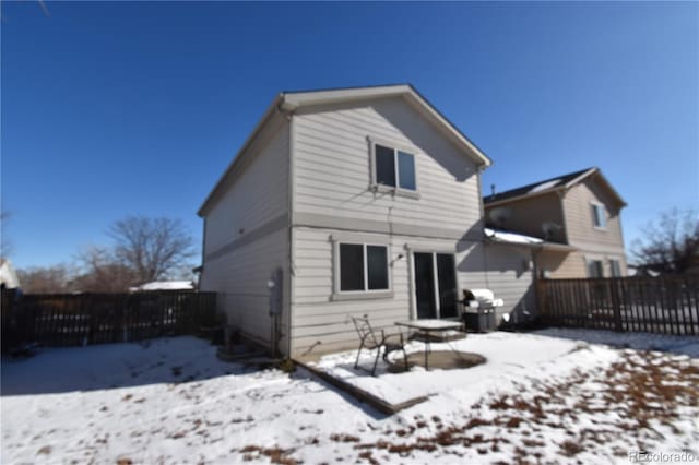 view of snow covered house