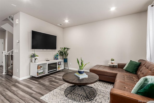 5187 S Fairplay St, Aurora, CO 80015 - living room featuring baseboards, recessed lighting, and wood finished floors