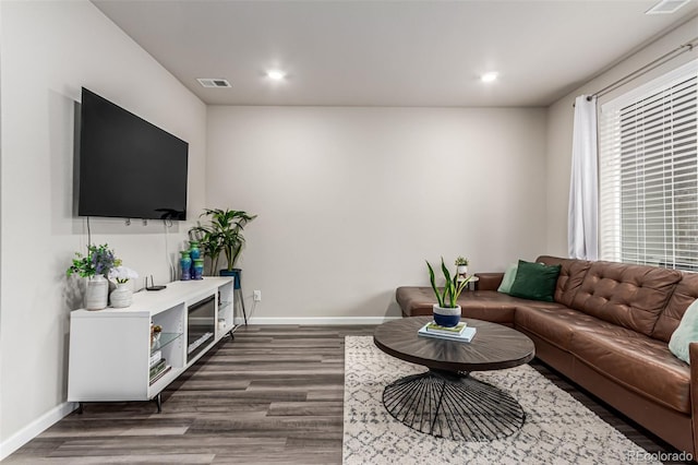 5187 S Fairplay St, Aurora, CO 80015 - living room featuring recessed lighting, baseboards, visible vents, and dark wood-type flooring