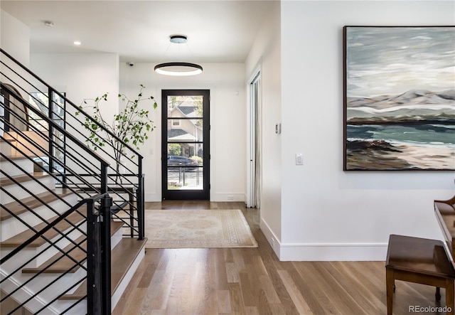 foyer entrance with hardwood / wood-style floors