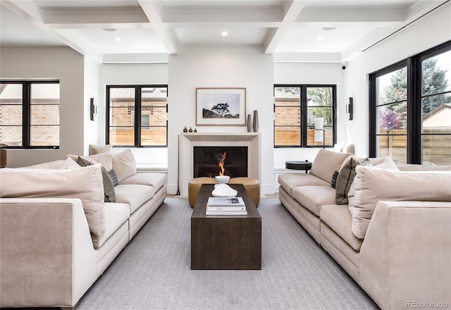 living room featuring beamed ceiling and coffered ceiling