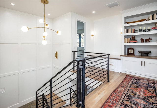 stairs with hardwood / wood-style flooring