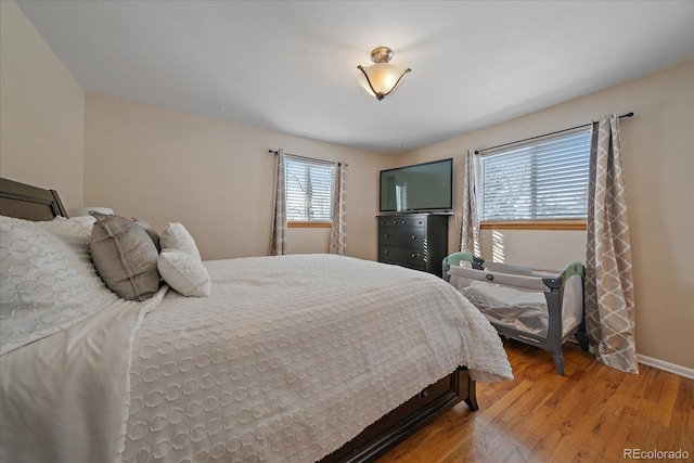 bedroom with hardwood / wood-style floors