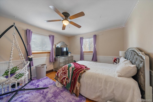 bedroom featuring light hardwood / wood-style floors and ceiling fan