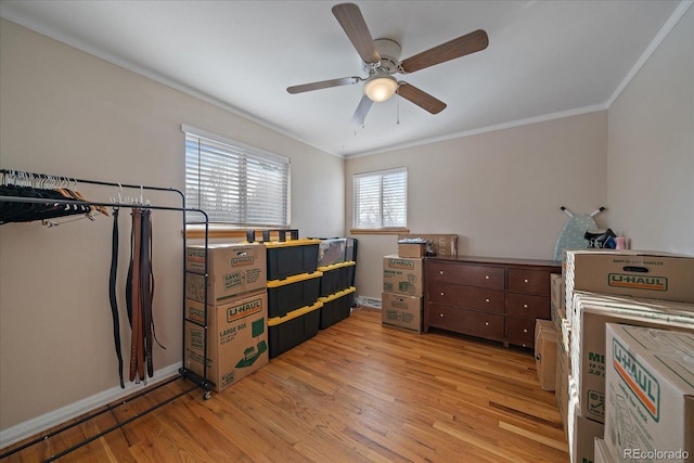 bedroom featuring ornamental molding, light hardwood / wood-style floors, and ceiling fan