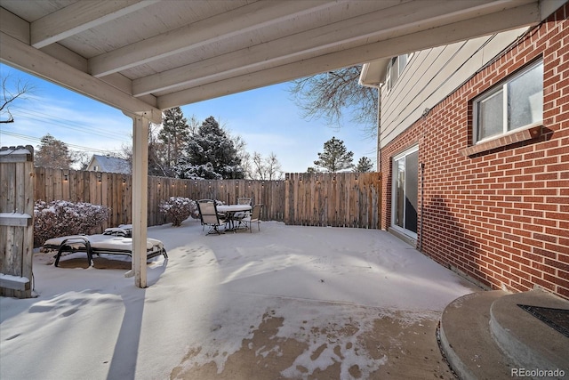 view of snow covered patio