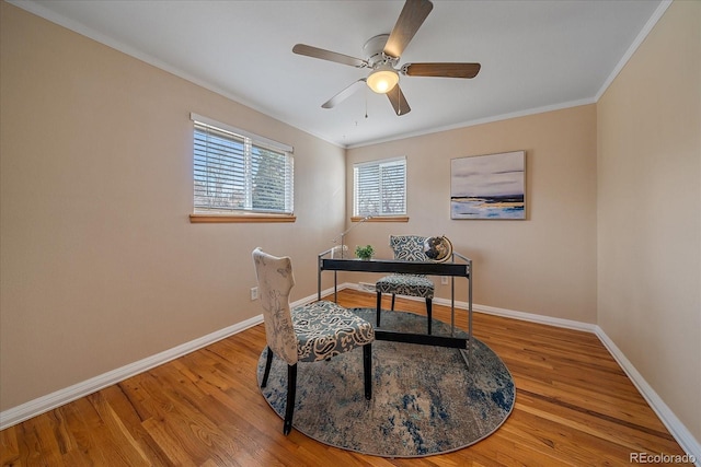 home office with ceiling fan, wood finished floors, baseboards, and ornamental molding