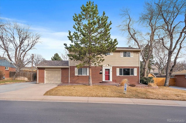 6940 S Uinta St, Centennial, CO 80112 - traditional home featuring a garage, a front lawn, fence, brick siding, and concrete driveway