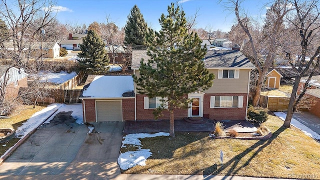 6940 S Uinta St, Centennial, CO 80112 - view of front facade with brick siding, a garage, fence, and a residential view