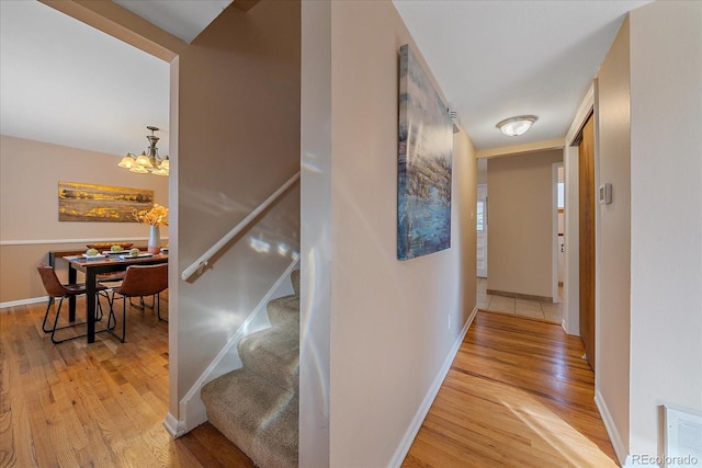 6940 S Uinta St, Centennial, CO 80112 - hall with visible vents, baseboards, a notable chandelier, and light wood finished floors