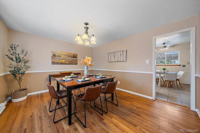 6940 S Uinta St, Centennial, CO 80112 - dining area featuring baseboards, a notable chandelier, and light wood finished floors