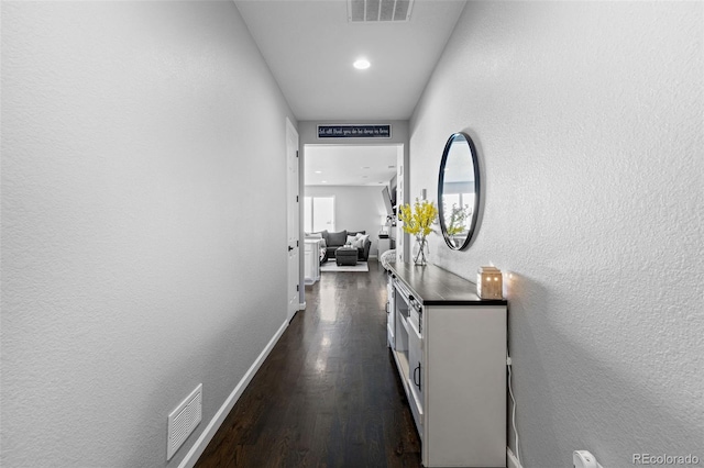 hallway featuring dark hardwood / wood-style floors