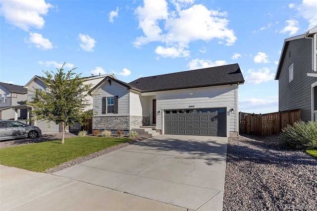 view of front facade featuring a garage and a front yard