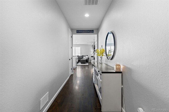 27491 E 10th Dr, Aurora, CO 80018 - hall with dark wood-style floors, recessed lighting, and a textured wall