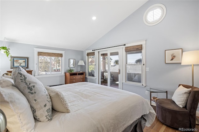 bedroom with wood finished floors, access to exterior, high vaulted ceiling, a baseboard heating unit, and recessed lighting